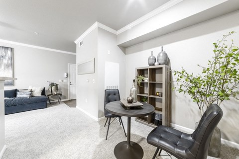 an open living room with a couch and a table